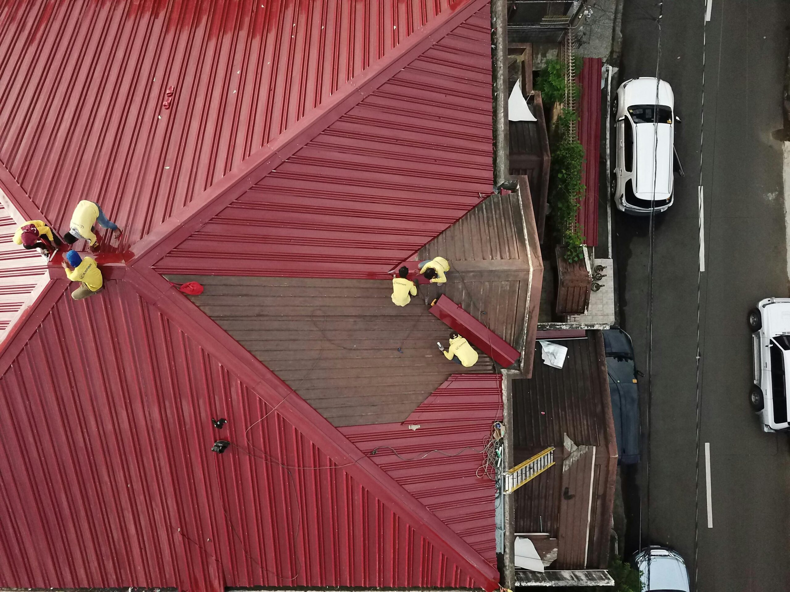 EPDM vs TPO roofing Queens NY comparison showing rubber membrane and white reflective flat roof